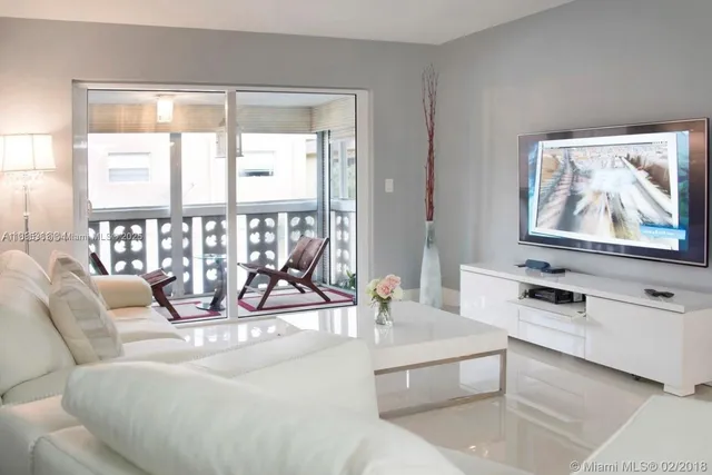 a view of a livingroom with furniture and windows