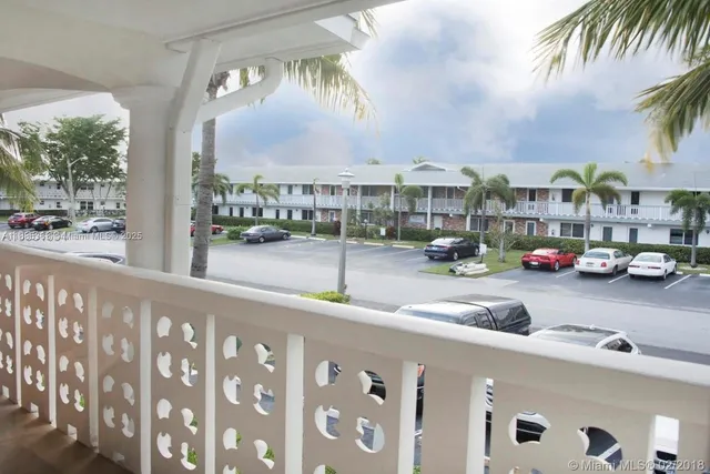 a view of a car parked in front of a brick house