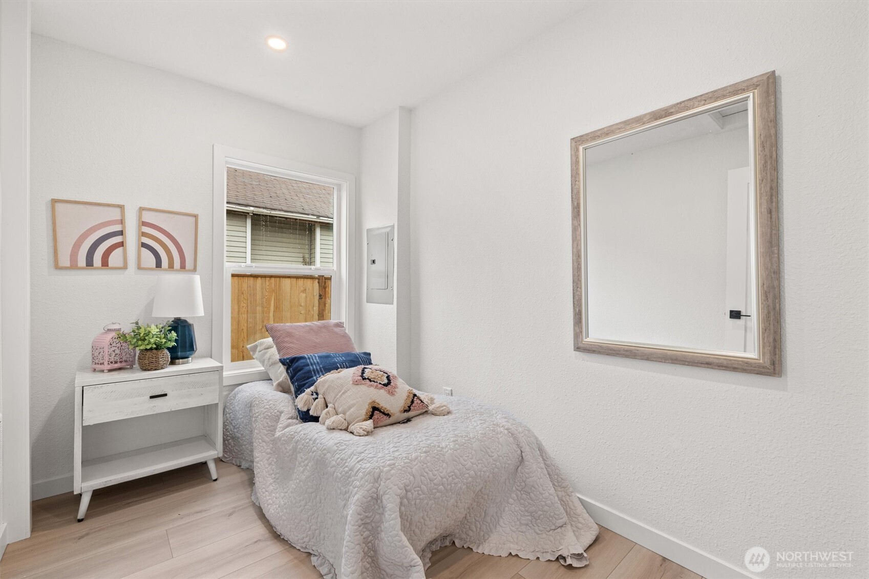 1310 North 3rd Street Renton, WA 98057 - Photo 13 of 16 a bed room with a bed and a couch