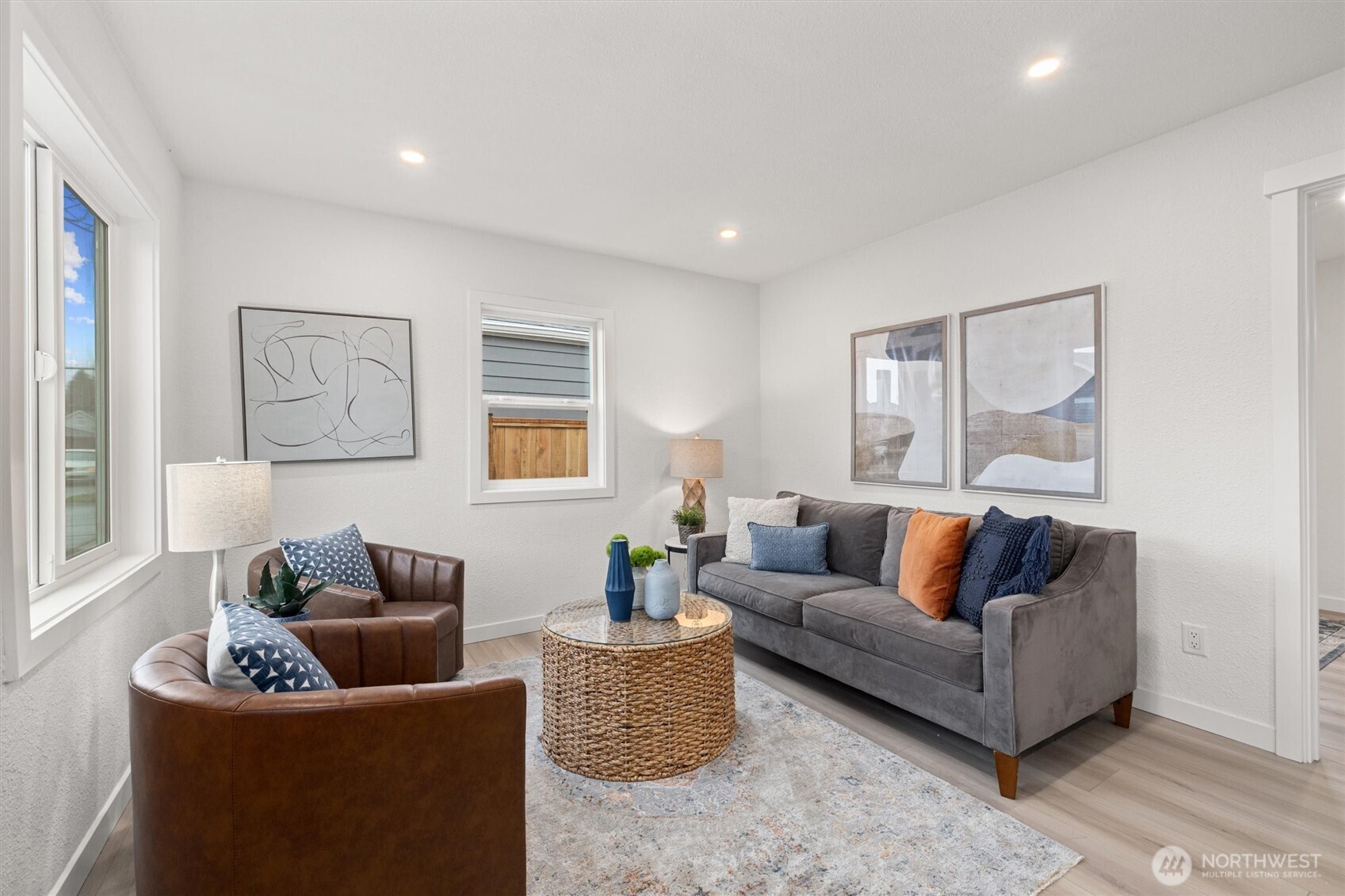 1310 North 3rd Street Renton, WA 98057 - Photo 2 of 16 a living room with furniture and a large window