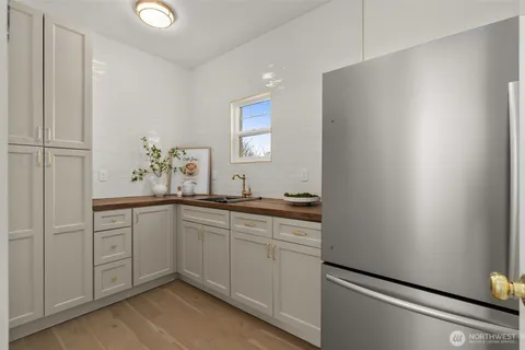 a spacious bathroom with a sink and mirror