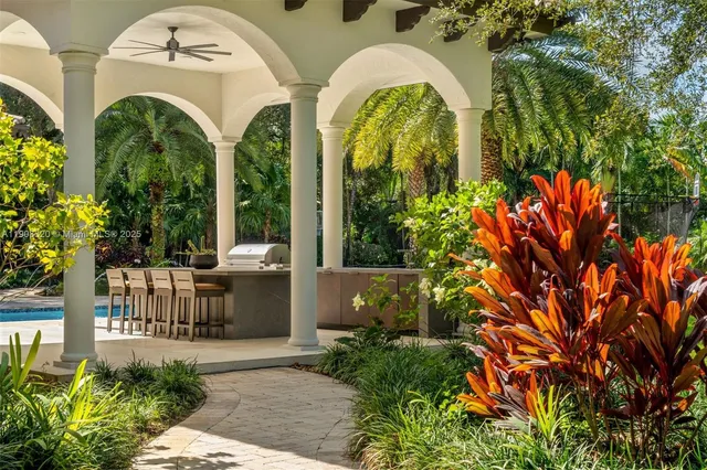 a view of a multi story building with a garden