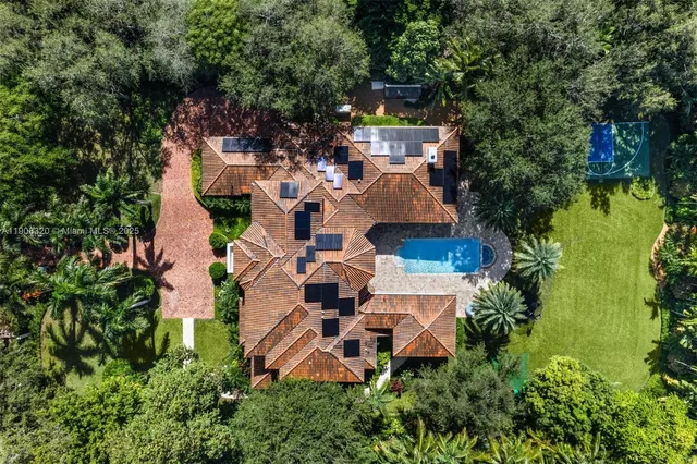 an aerial view of a house with outdoor space