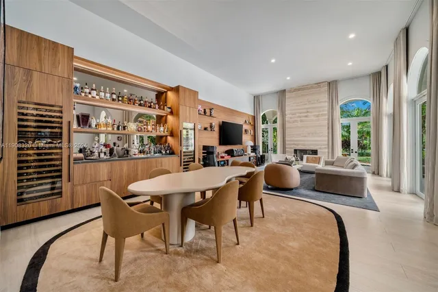 a view of a dining room with furniture and window