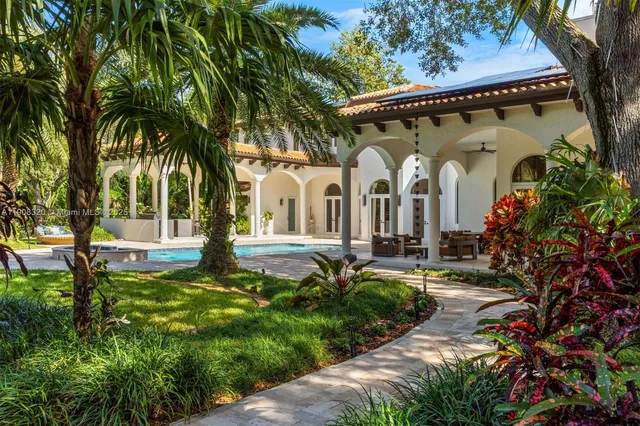 a front view of a house with garden