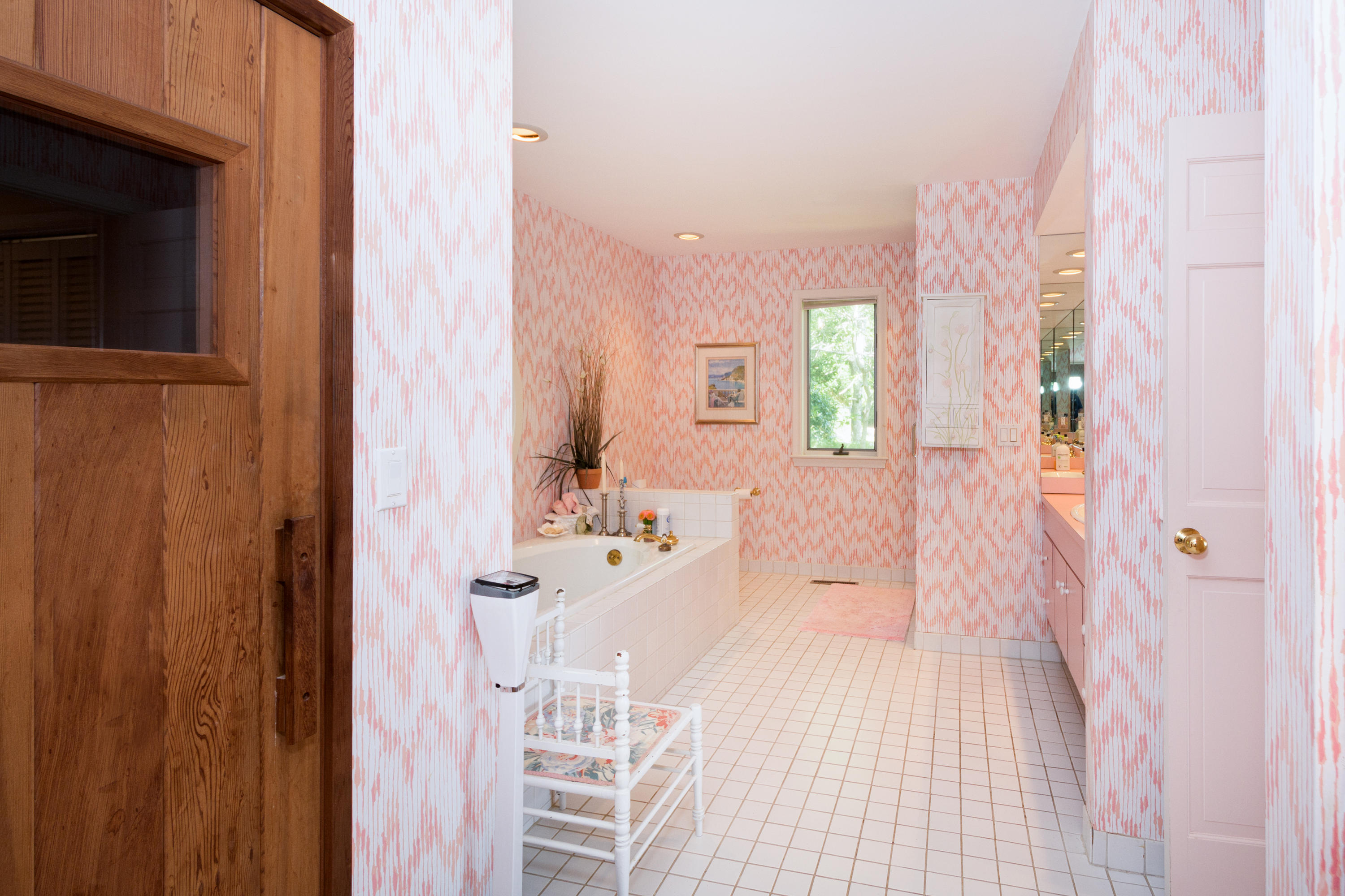 107 Tide Run Mashpee, MA 02649 - Photo 14 of 35 a bathroom with a bathtub shower sink and mirror