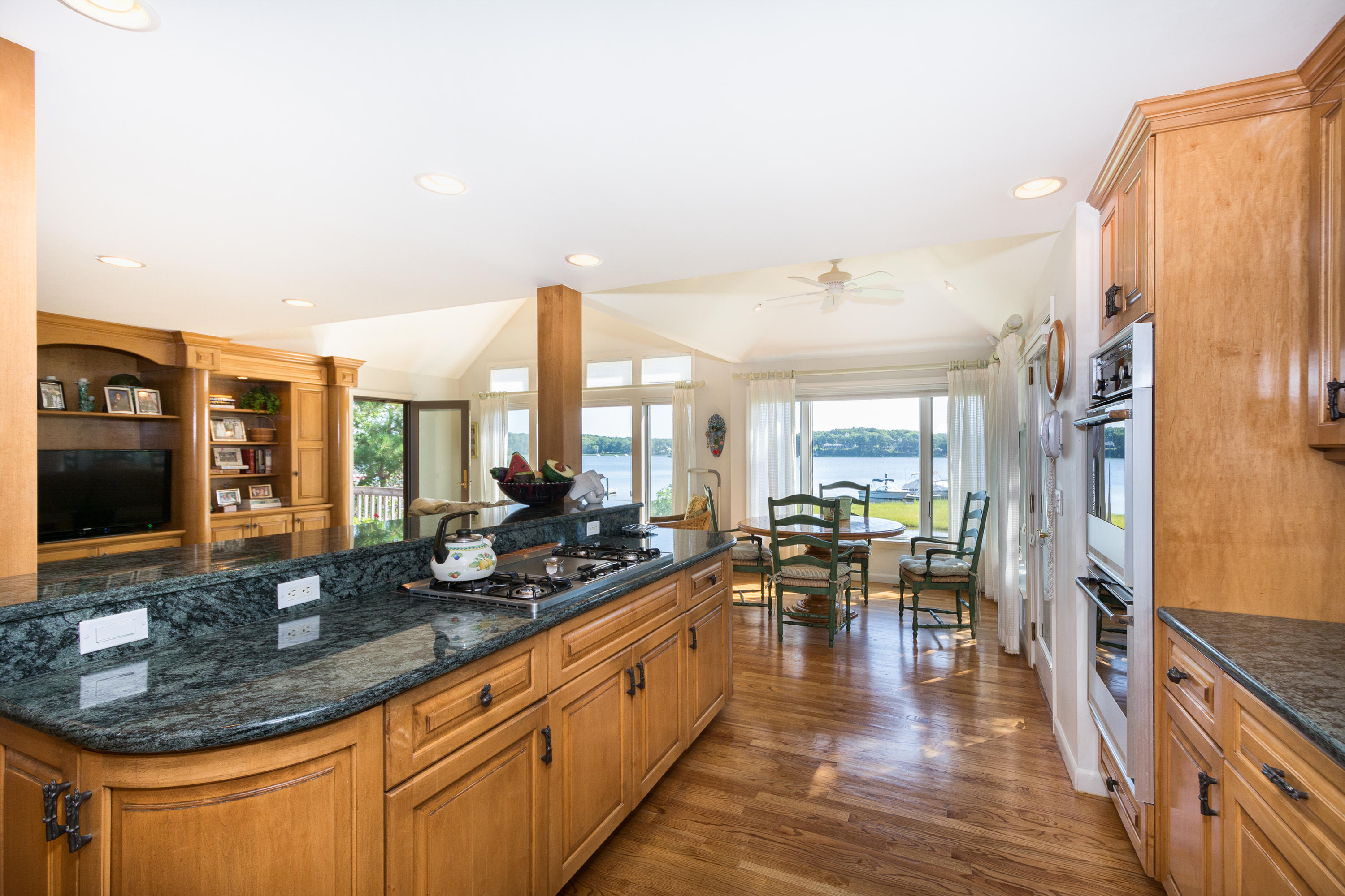 107 Tide Run Mashpee, MA 02649 - Photo 17 of 35 a kitchen with counter top space and wooden floor