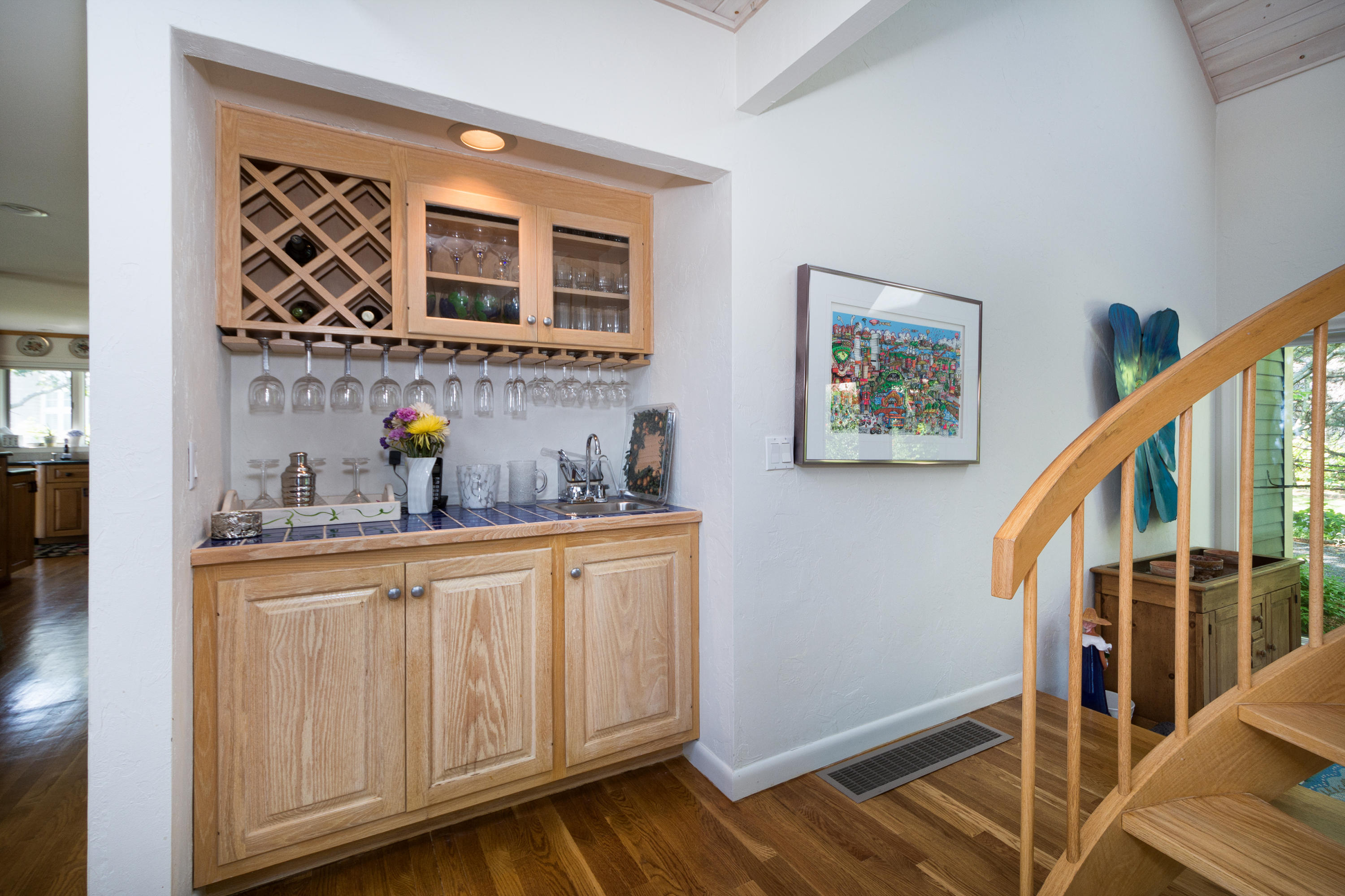 107 Tide Run Mashpee, MA 02649 - Photo 19 of 35 a kitchen with wooden cabinets and a sink