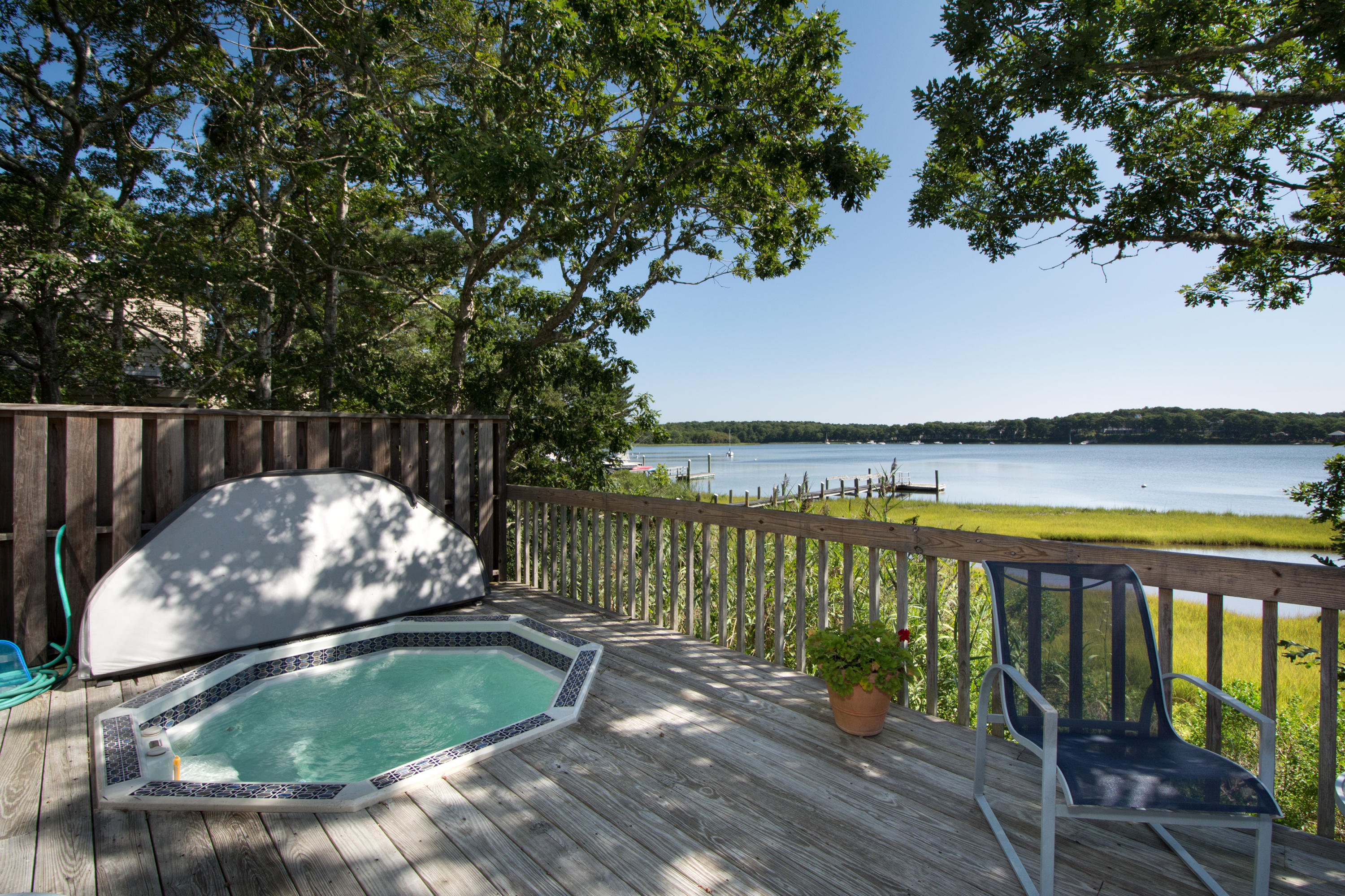 107 Tide Run Mashpee, MA 02649 - Photo 20 of 35 a view of a wooden deck and a lake view