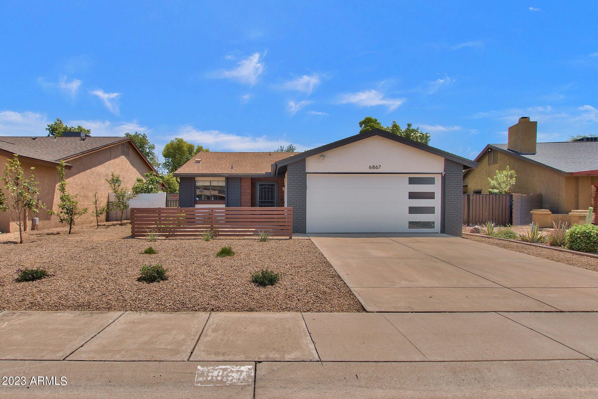a front view of a house with garage