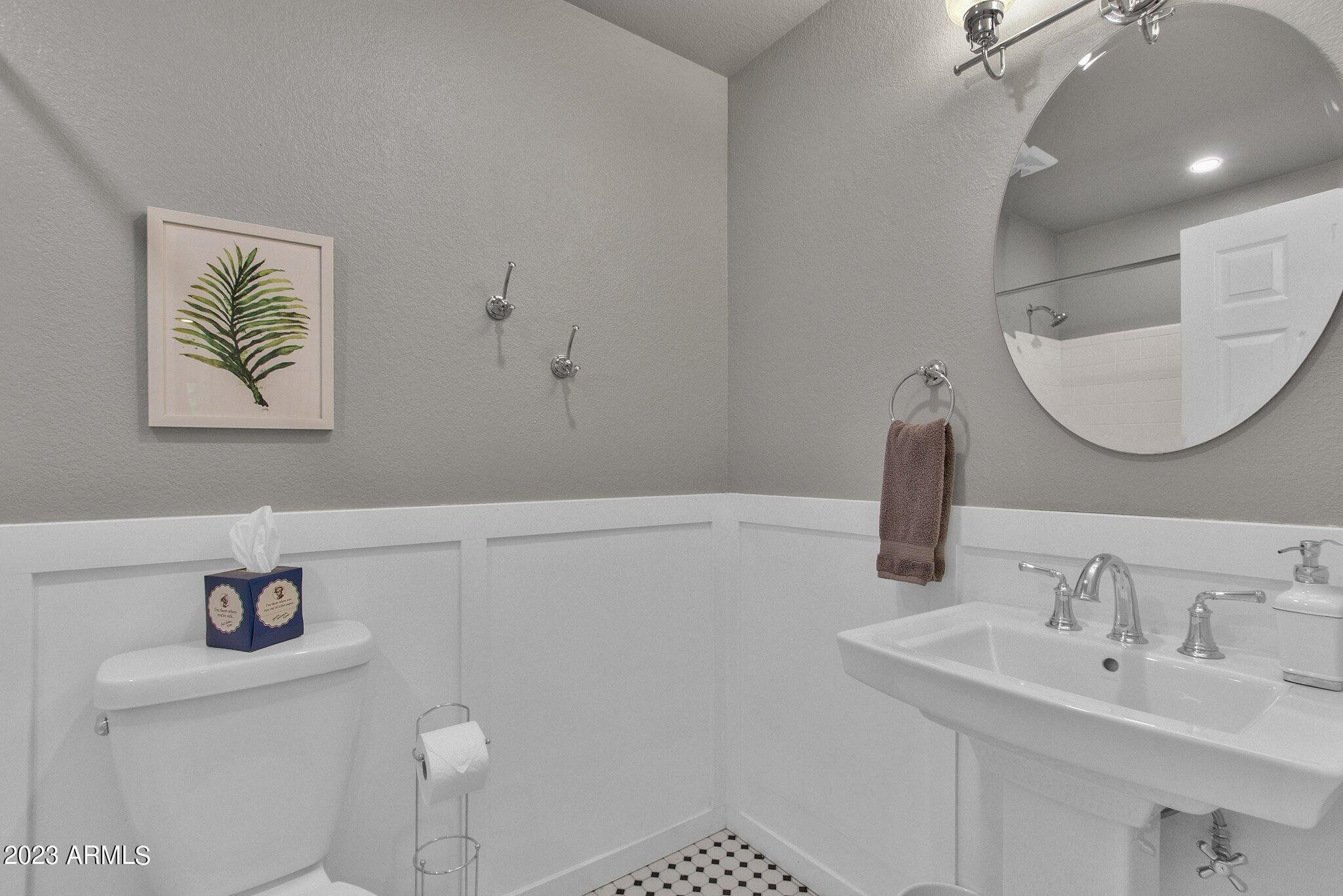 6867 East Phelps Road Scottsdale, AZ 85254 - Photo 11 of 20 a bathroom with a sink and a mirror