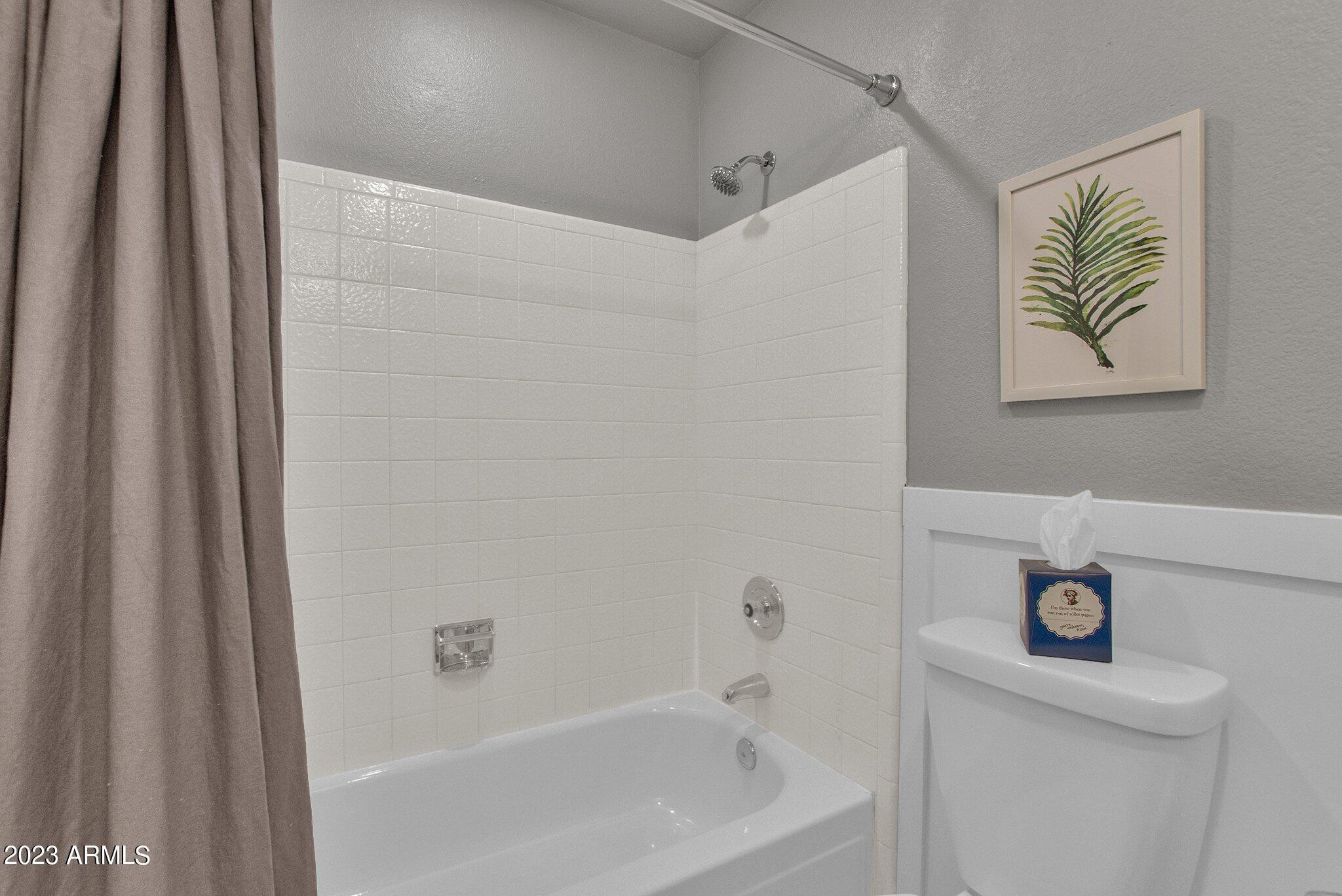 6867 East Phelps Road Scottsdale, AZ 85254 - Photo 12 of 20 a bathroom with a bathtub