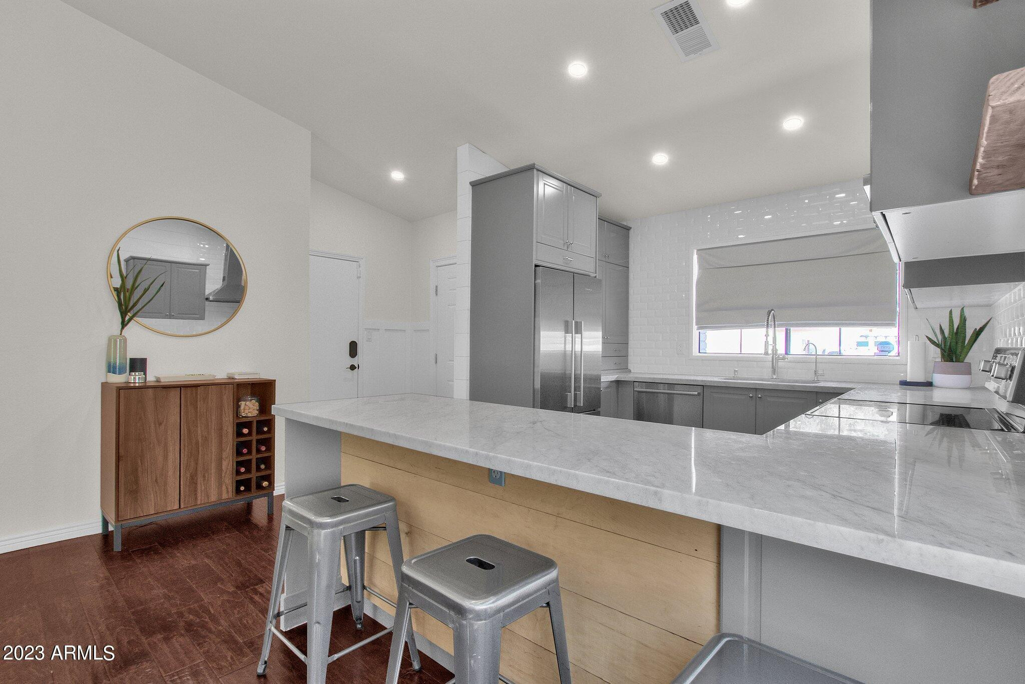 6867 East Phelps Road Scottsdale, AZ 85254 - Photo 14 of 20 a large kitchen with a table and chairs
