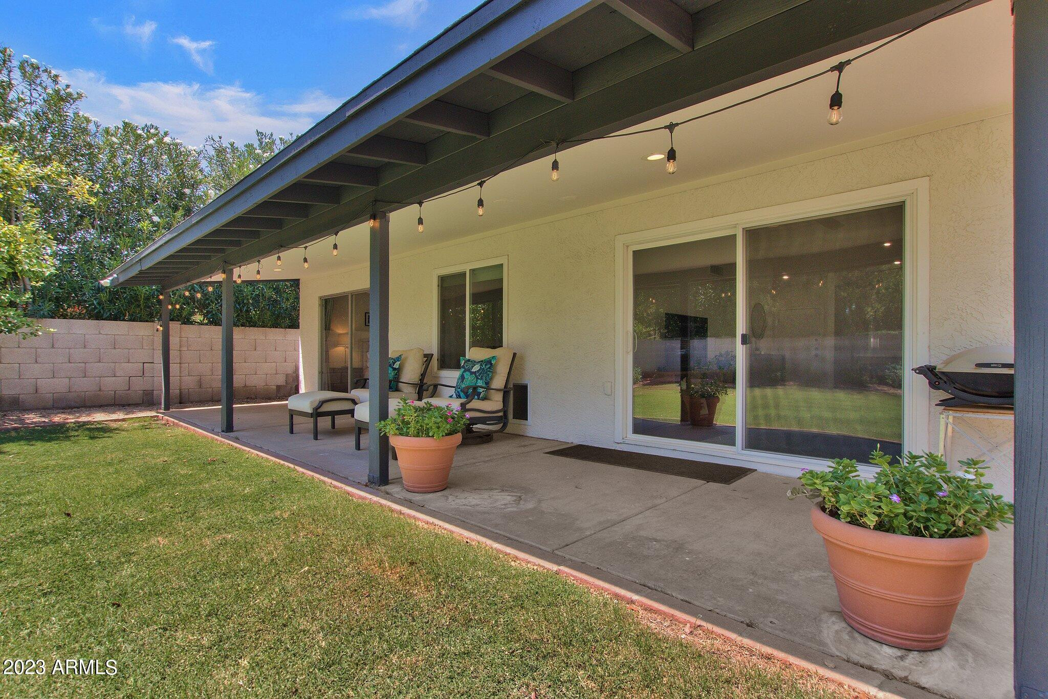 6867 East Phelps Road Scottsdale, AZ 85254 - Photo 16 of 20 a view of a backyard with sitting area and garden