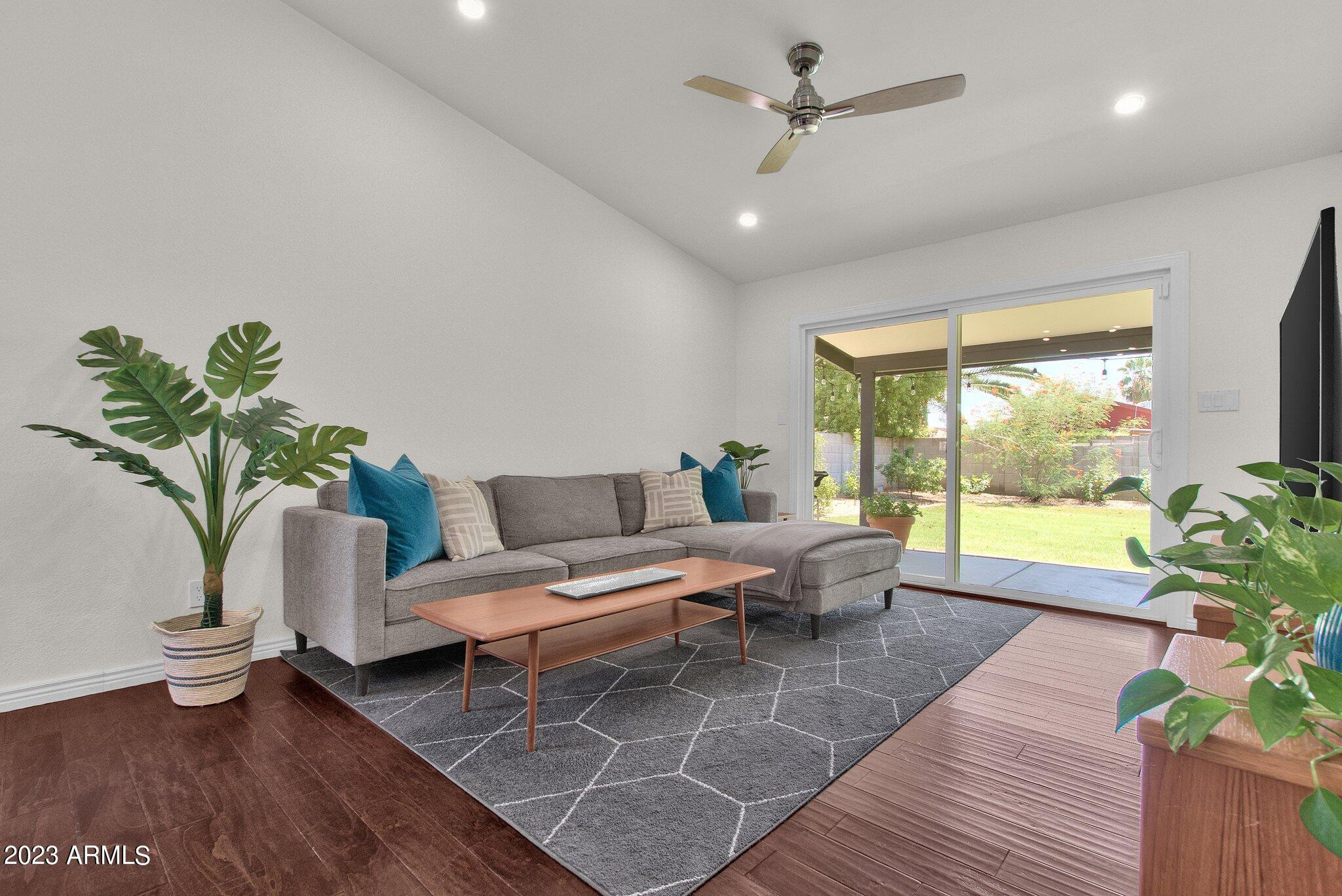 6867 East Phelps Road Scottsdale, AZ 85254 - Photo 5 of 20 a living room with furniture and a large window with wooden floor