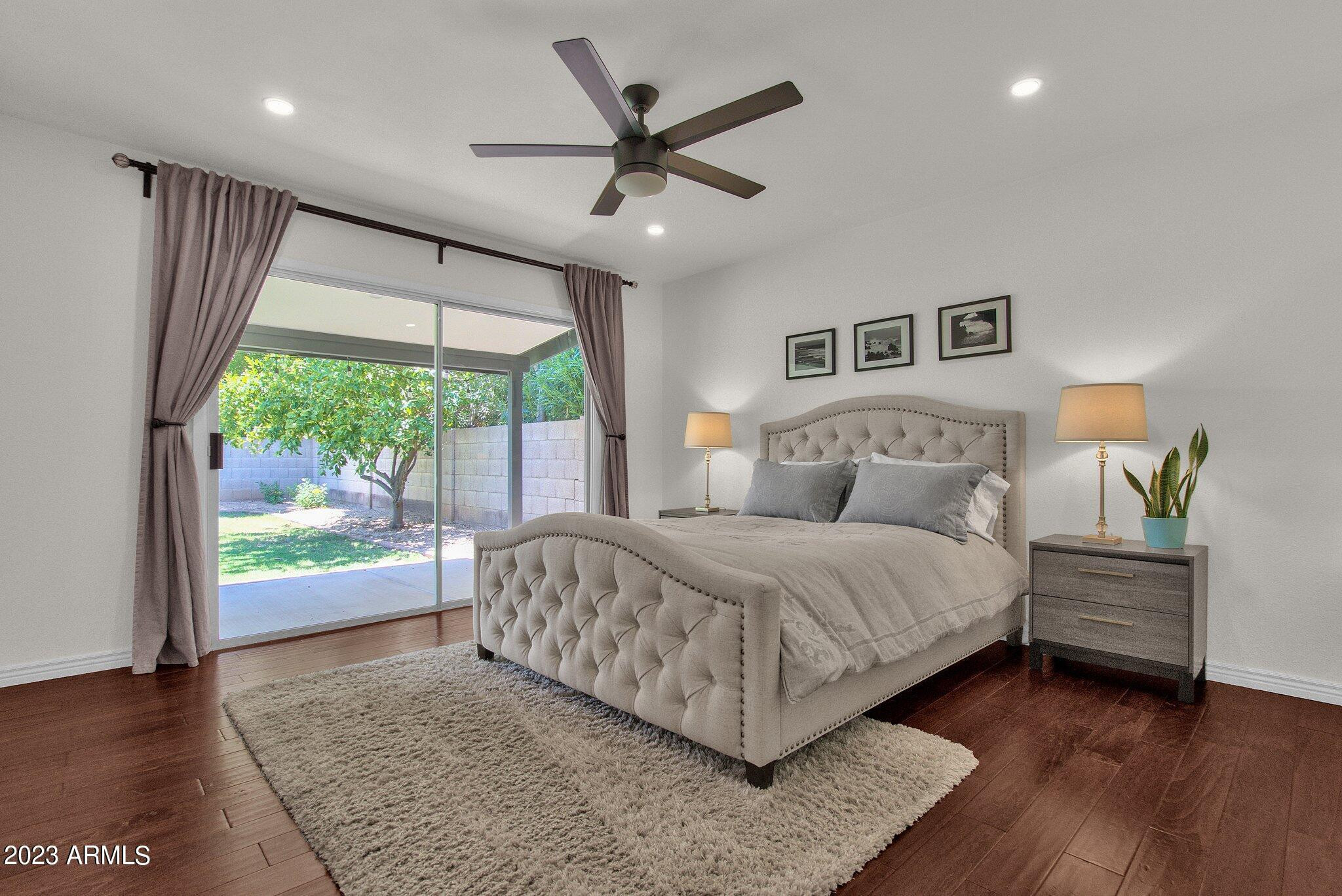 6867 East Phelps Road Scottsdale, AZ 85254 - Photo 8 of 20 a bedroom with a large bed and a large window