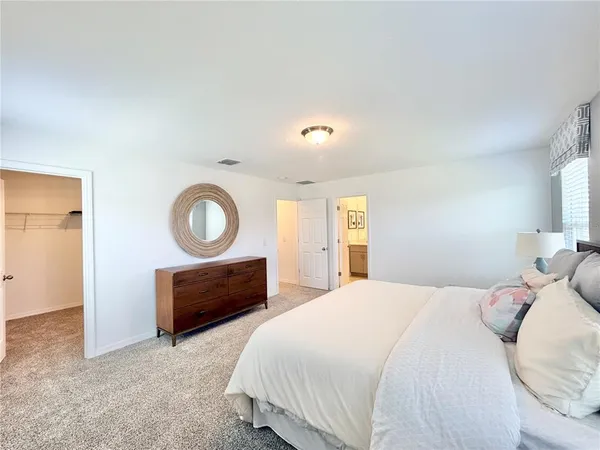 a bedroom with a bed and a closet
