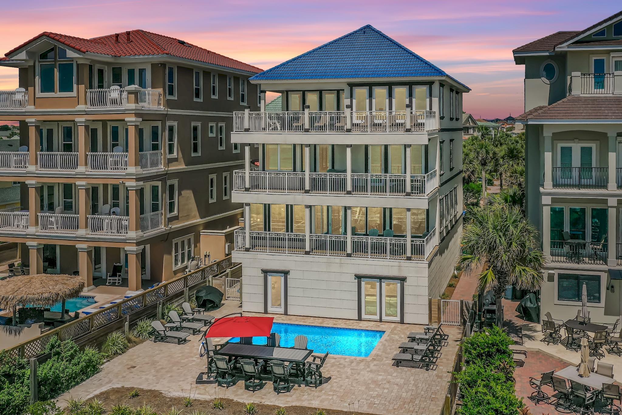 114 Sandprint Circle Destin, FL 32541 - Photo 1 of 57 a front view of a residential apartment building with a yard