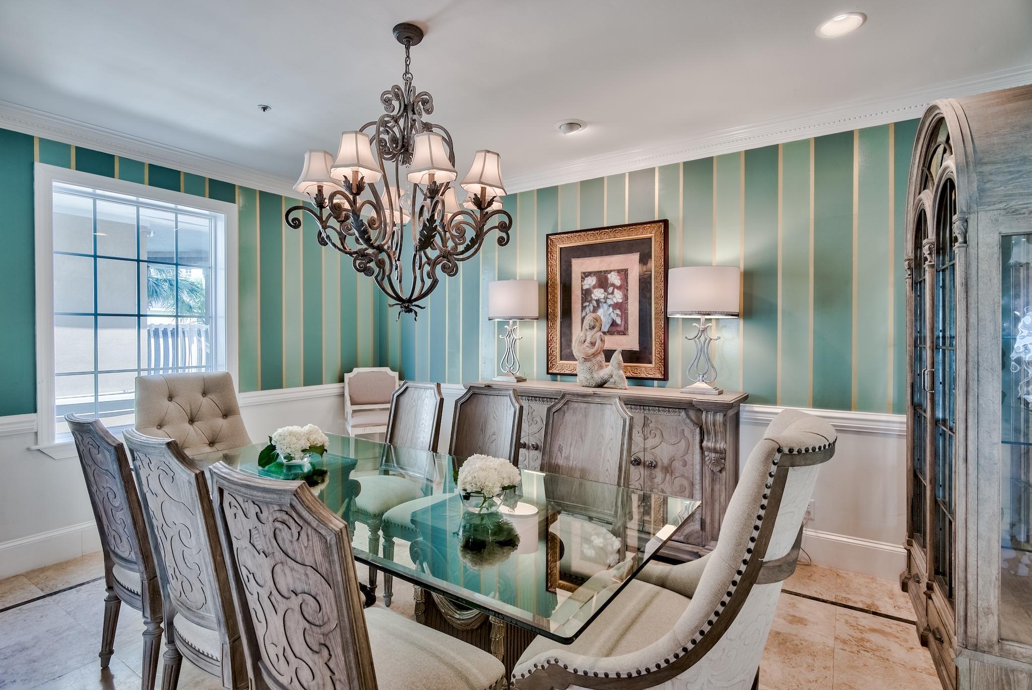 114 Sandprint Circle Destin, FL 32541 - Photo 21 of 57 a view of a dining room with furniture a chandelier and large windows