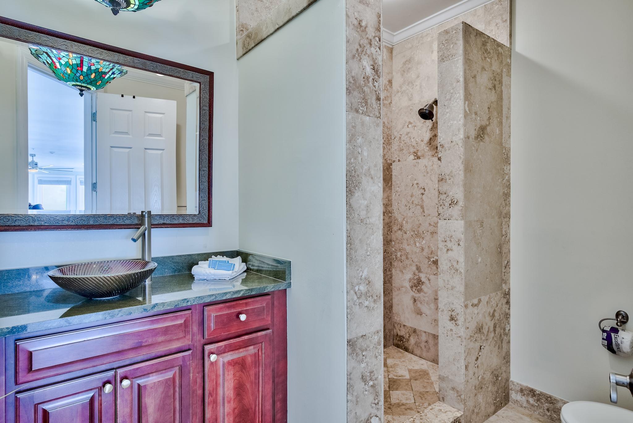 114 Sandprint Circle Destin, FL 32541 - Photo 38 of 57 a bathroom with a granite countertop sink a mirror and shower