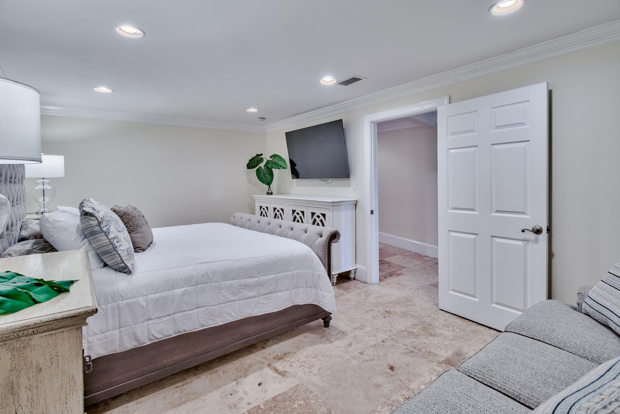 114 Sandprint Circle Destin, FL 32541 - Photo 44 of 57 a bedroom with a bed and a flat screen tv