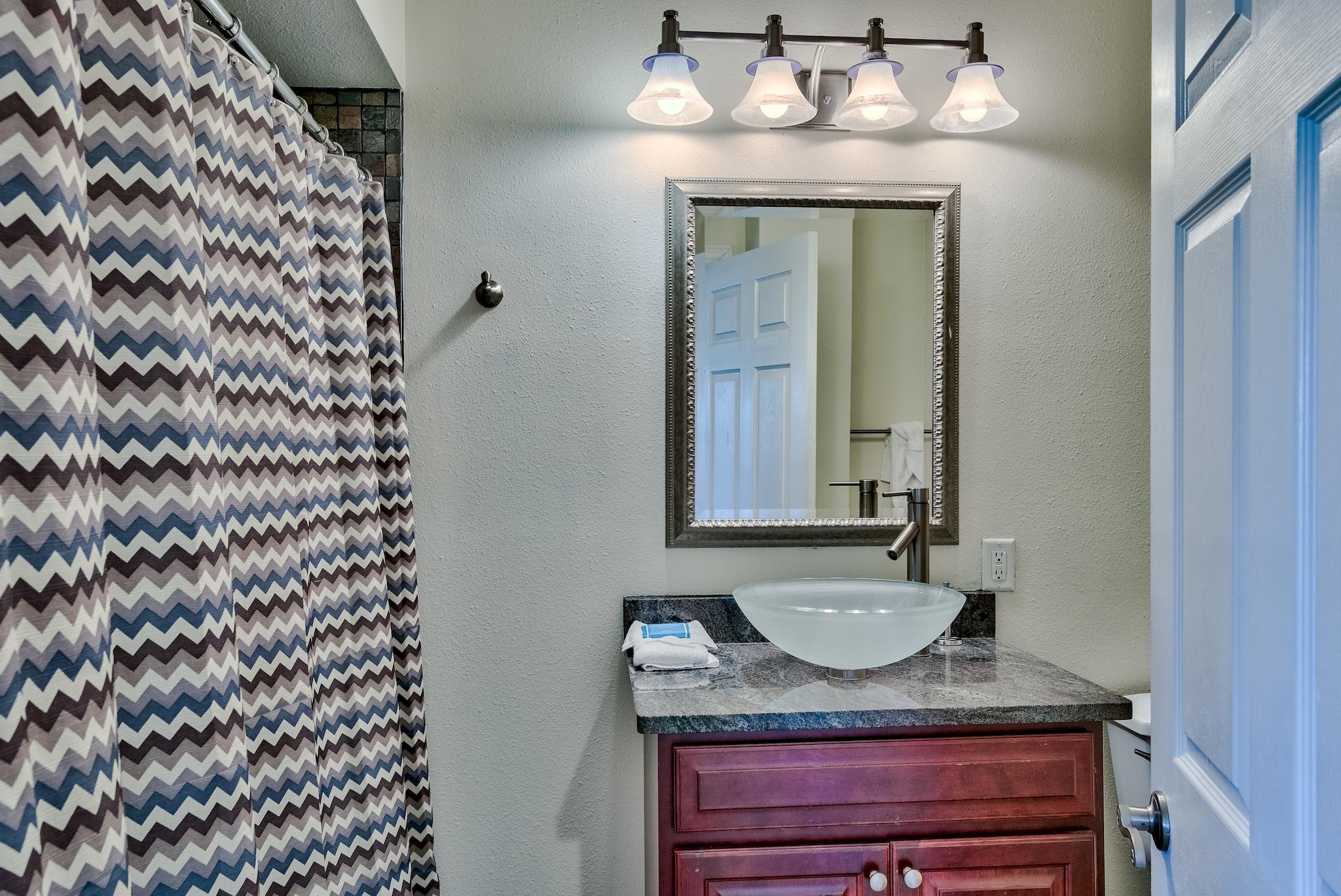 114 Sandprint Circle Destin, FL 32541 - Photo 46 of 57 a bathroom with a granite countertop sink and a mirror