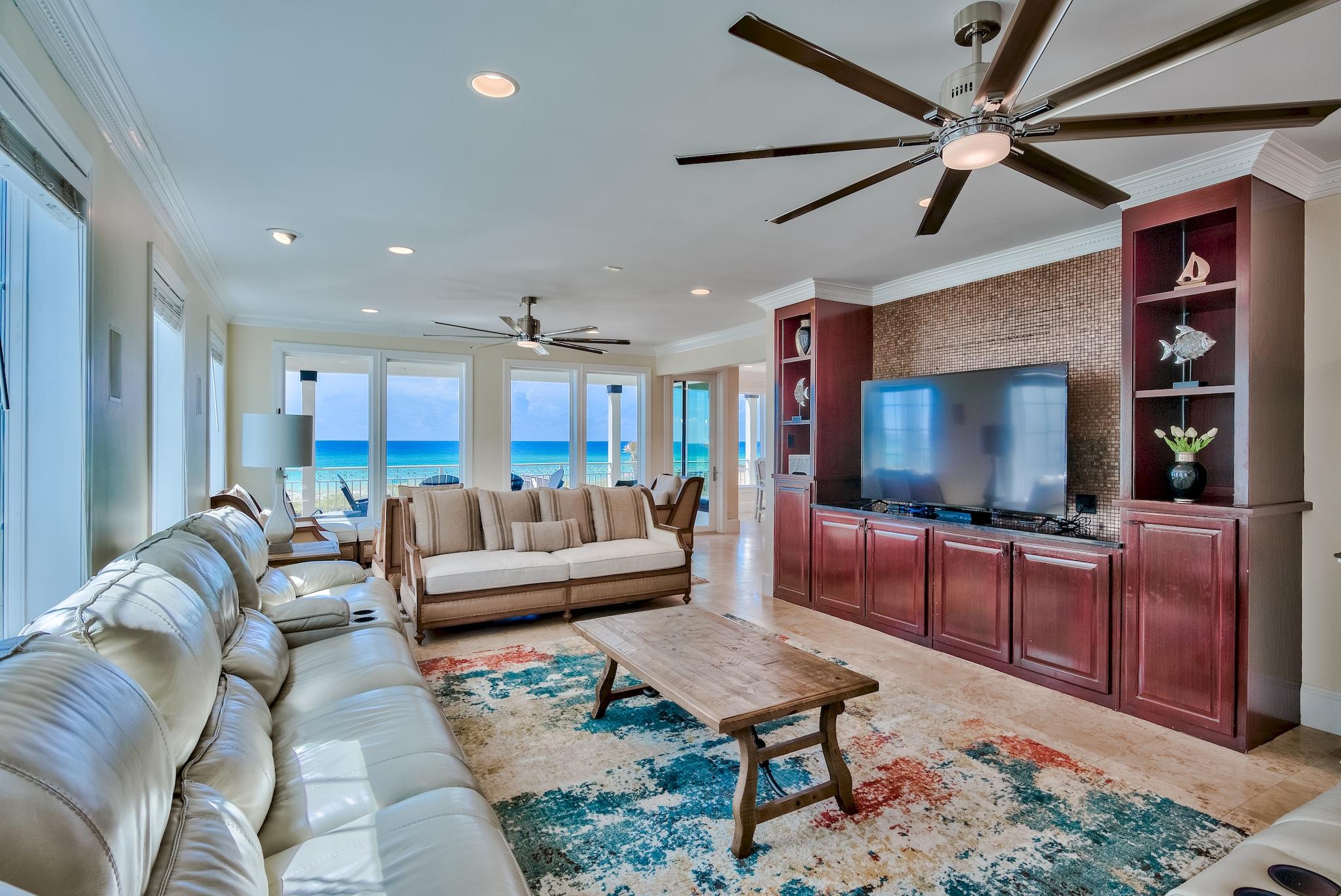 114 Sandprint Circle Destin, FL 32541 - Photo 7 of 57 a living room with furniture a flat screen tv and kitchen view