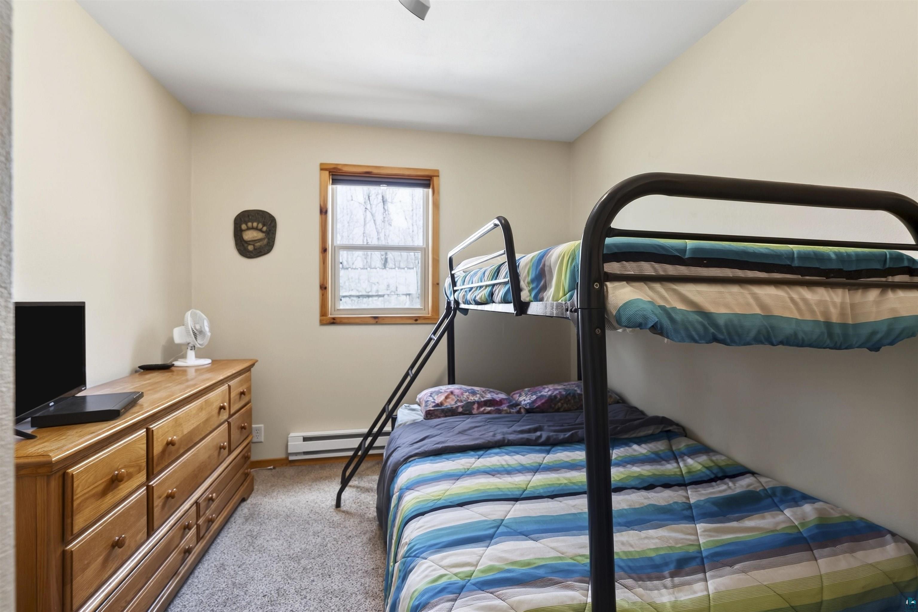 12235 East Crooked Lake Road Gordon, WI 54838 - Photo 27 of 48 Interior room featuring neutral wall tones and carpeted flooring