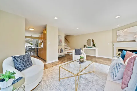 a living room with furniture and a table