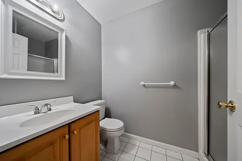 a bathroom with a sink toilet and vanity