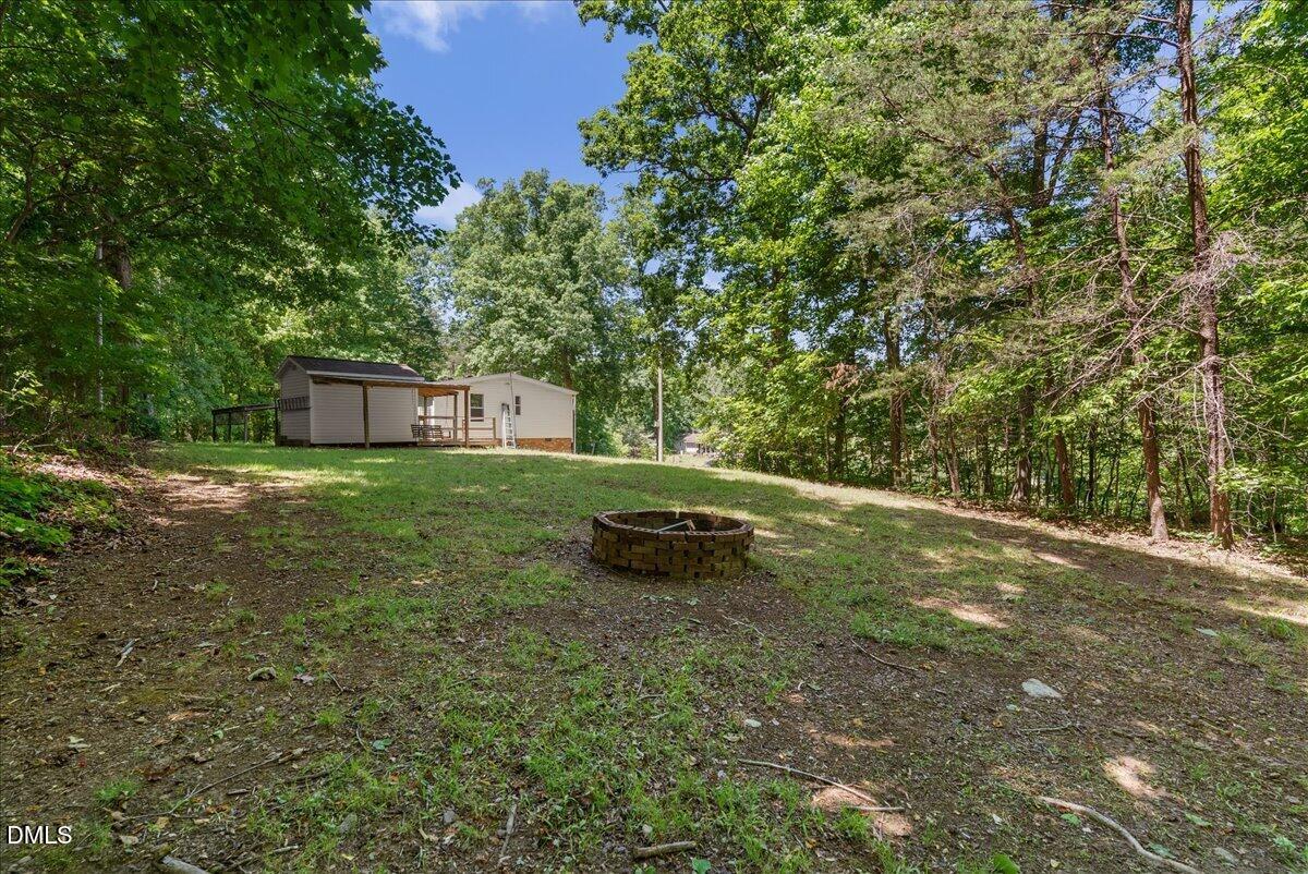 1111 Stoney Mountain Road Rougemont, NC 27572 - Photo 27 of 30 a view of a backyard with a small area