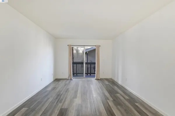 a view of wooden floor in an empty room
