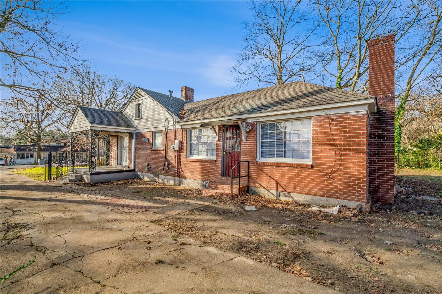 1114 Brownlee Road Memphis, TN 38116 - Photo 29 of 32 Bungalow featuring a chimney, brick siding, and a shingled roof