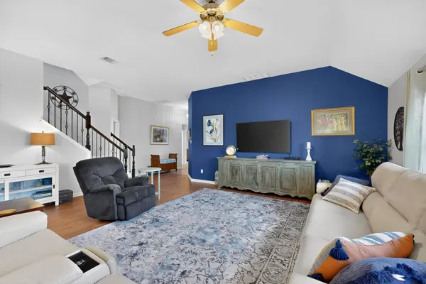 a living room with furniture and a flat screen tv