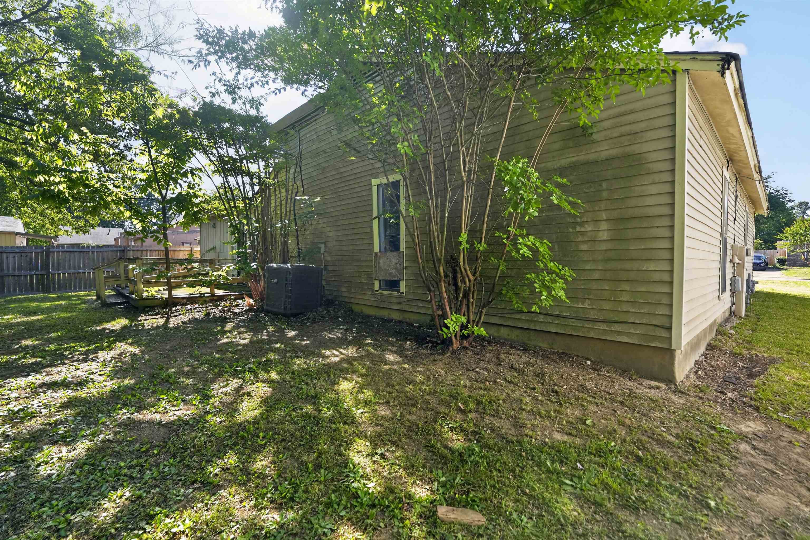 3372 Spring Shadow Drive Memphis, TN 38118 - Photo 10 of 35 Exterior siding with foundation planting and visible HVAC unit