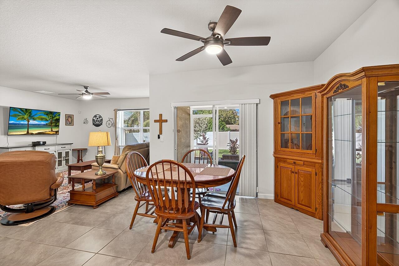 105 Cardinal Drive Sebastian, FL 32958 - Photo 19 of 45 a dining room with furniture window and wooden floor
