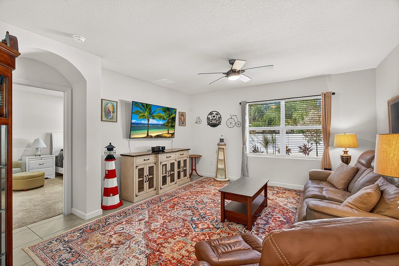 105 Cardinal Drive Sebastian, FL 32958 - Photo 20 of 45 a living room with furniture and a flat screen tv