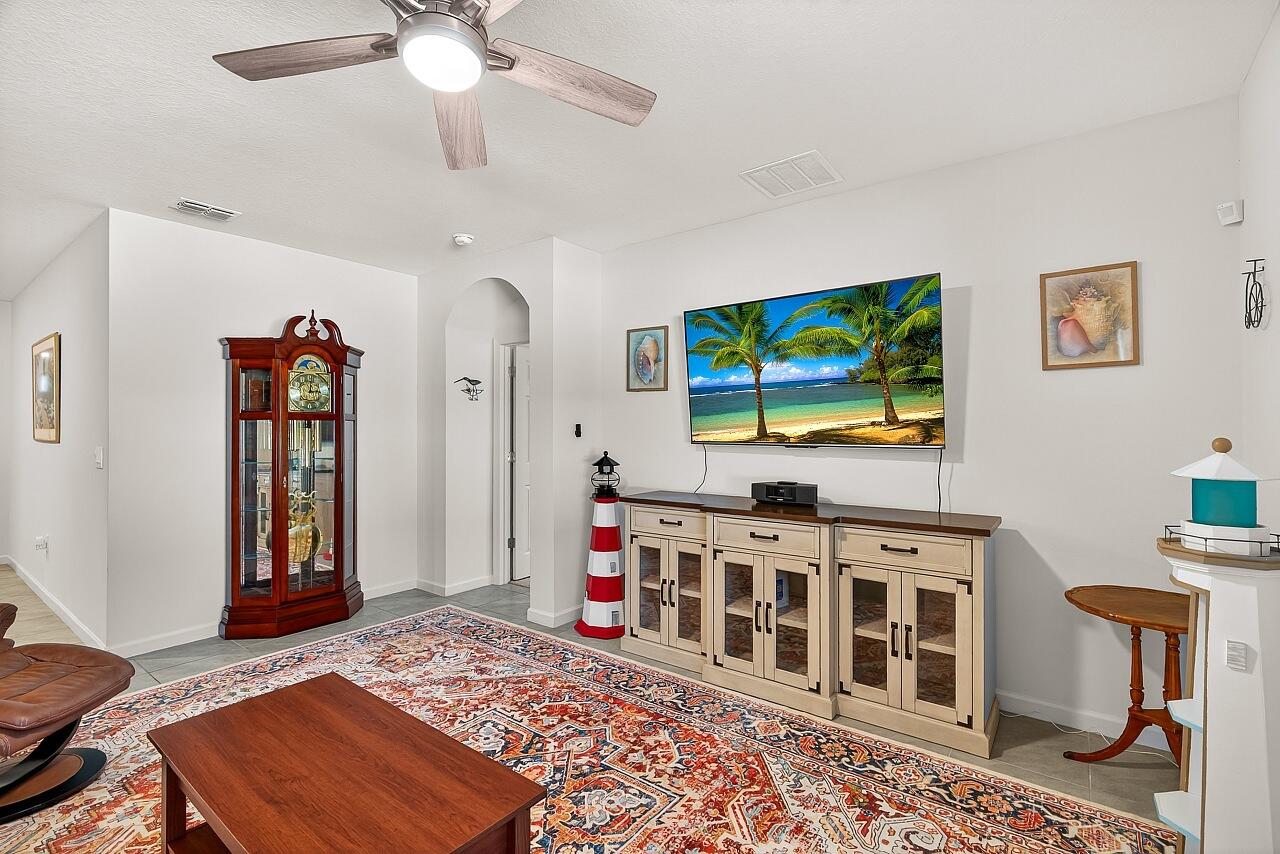 105 Cardinal Drive Sebastian, FL 32958 - Photo 21 of 45 a living room with furniture and a flat screen tv
