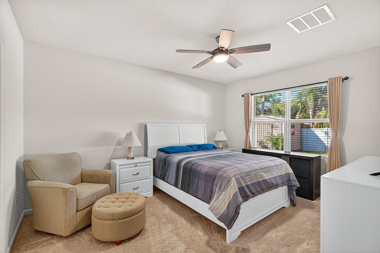 105 Cardinal Drive Sebastian, FL 32958 - Photo 24 of 45 a bedroom with a bed and window