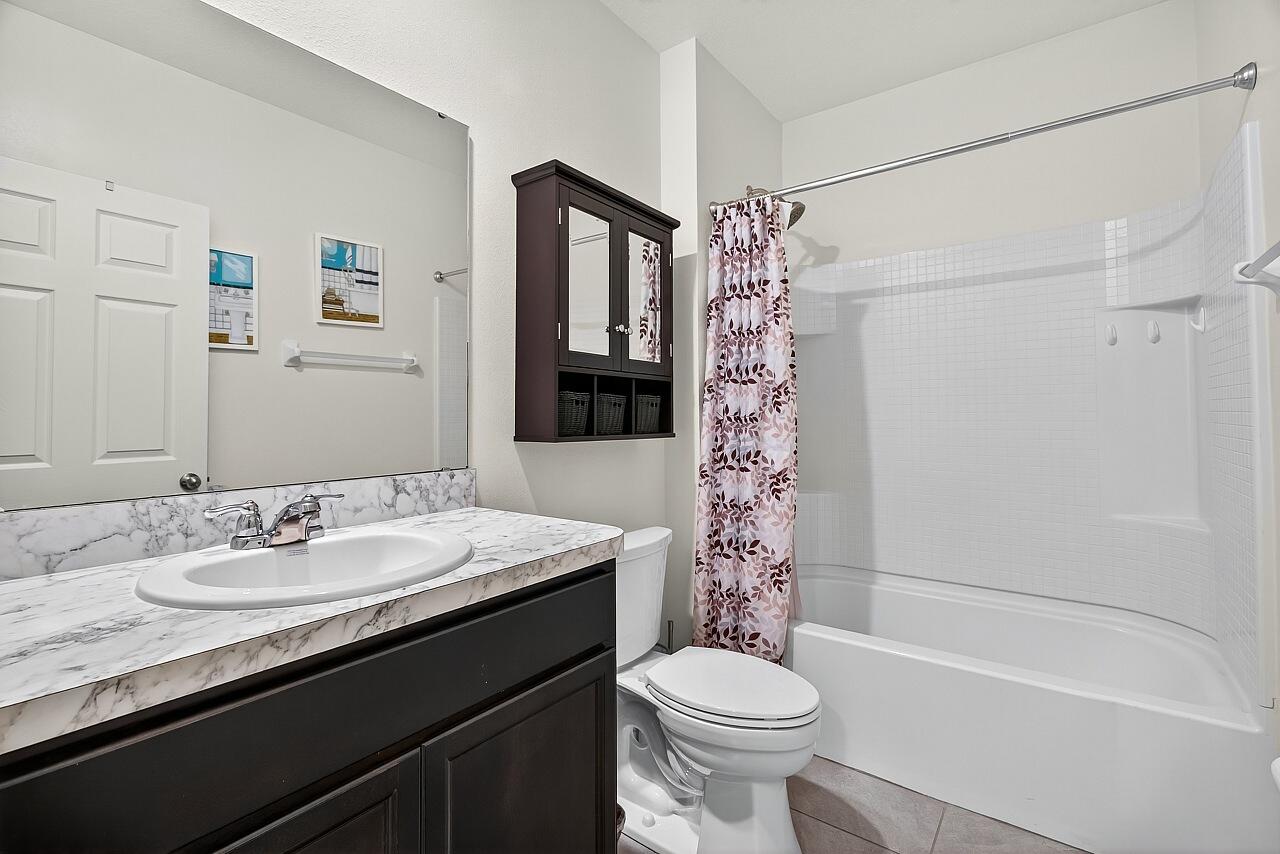 105 Cardinal Drive Sebastian, FL 32958 - Photo 33 of 45 a bathroom with a sink a toilet and shower