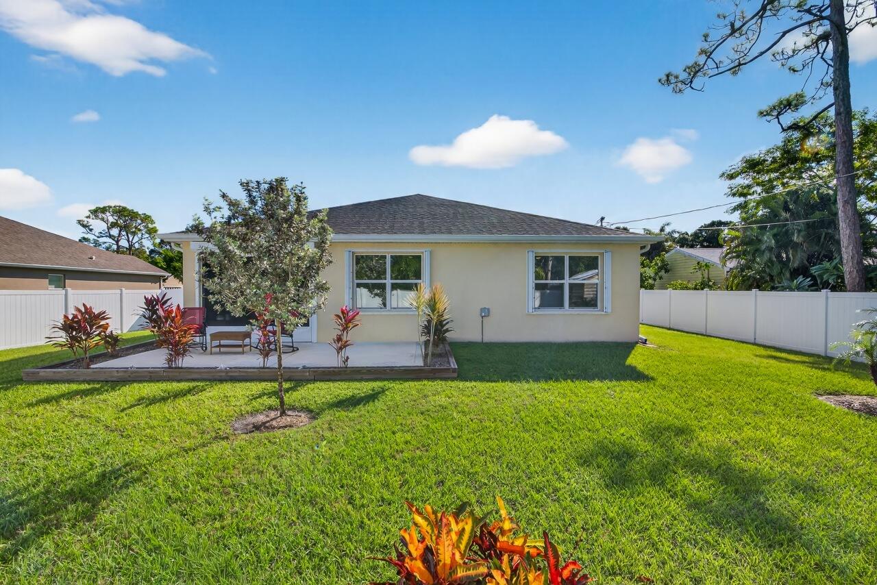 105 Cardinal Drive Sebastian, FL 32958 - Photo 44 of 45 a view of a house with a yard and sitting area