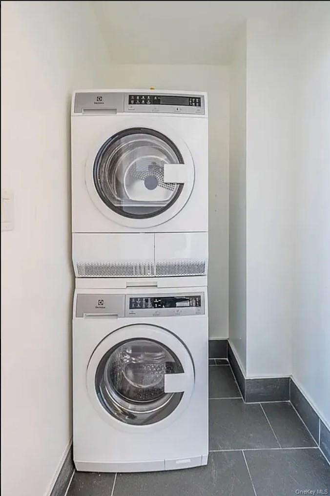 41-04 27th Street, Unit 9A Queens, NY 11101 - Photo 8 of 14 a utility room with dryer and washer