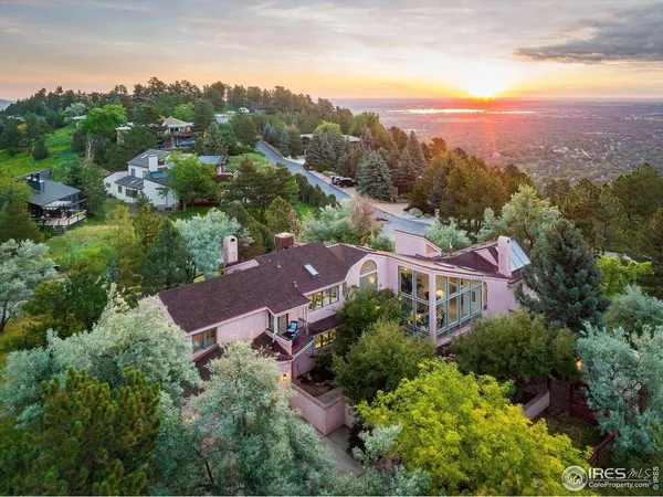an aerial view of a house with mountain view