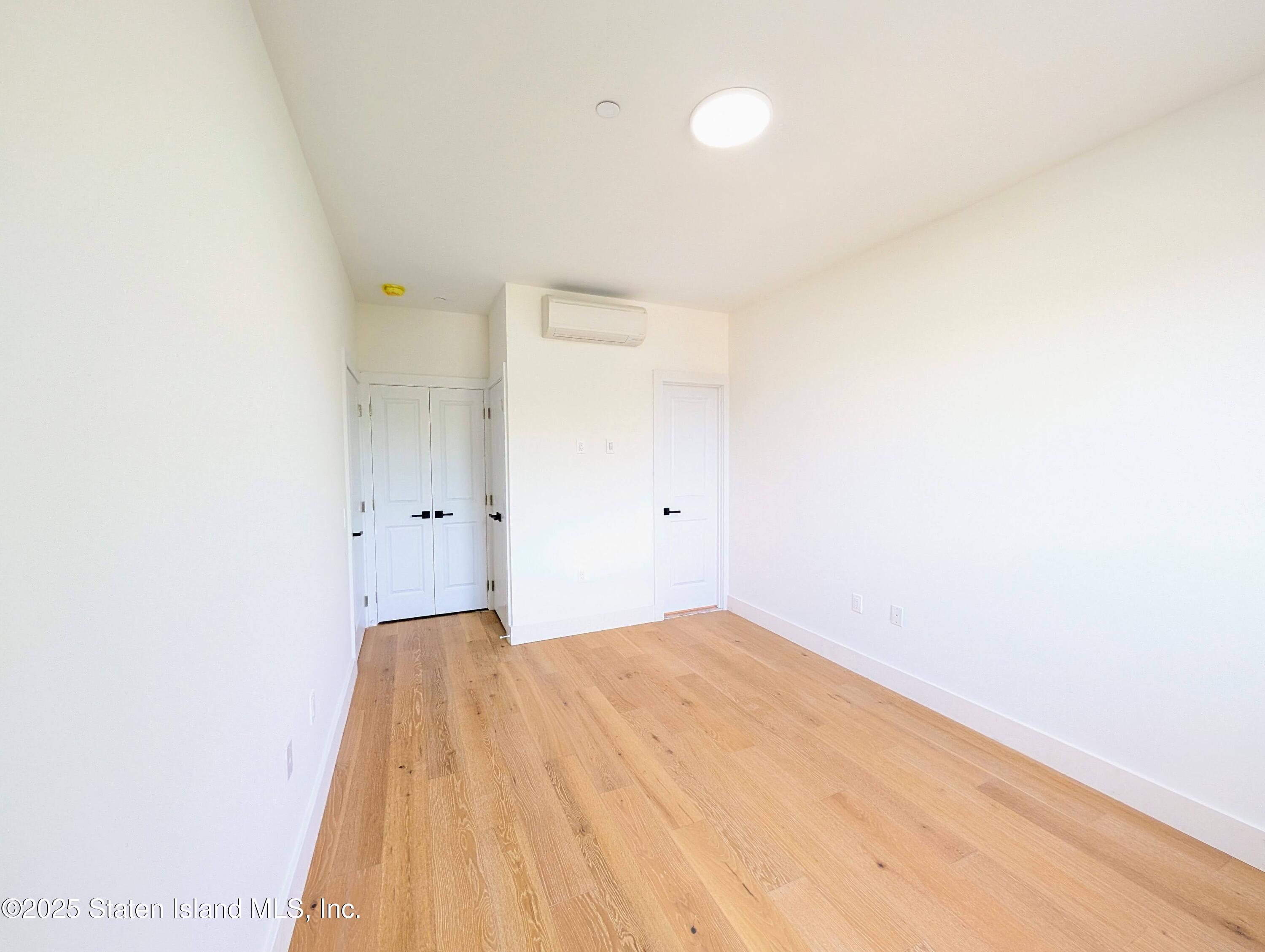 3865 Amboy Road, Unit 4D Staten Island, NY 10308 - Photo 15 of 30 a view of a big room with wooden floor