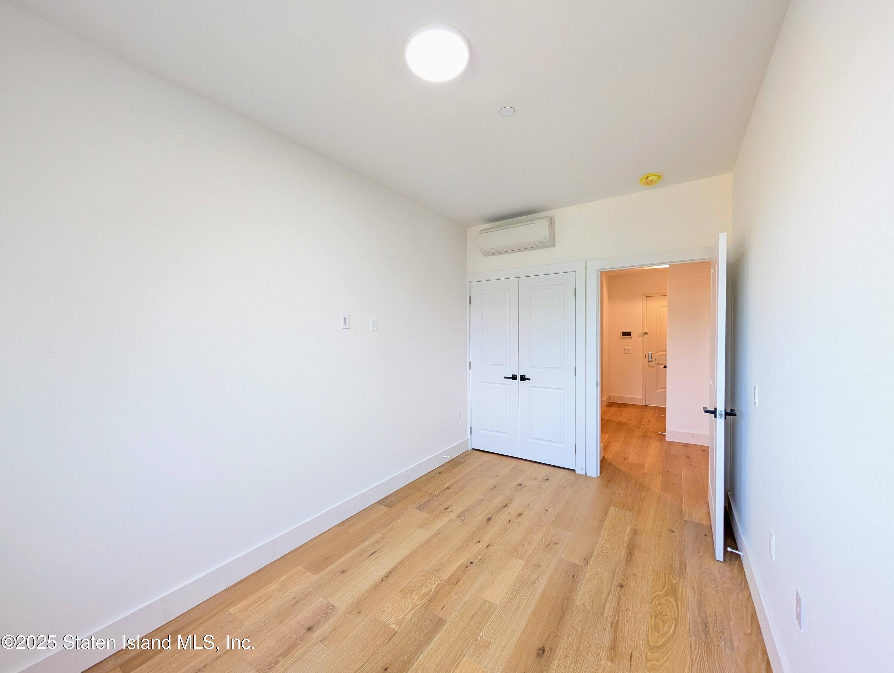 3865 Amboy Road, Unit 4D Staten Island, NY 10308 - Photo 17 of 30 a view of a room with wooden floor