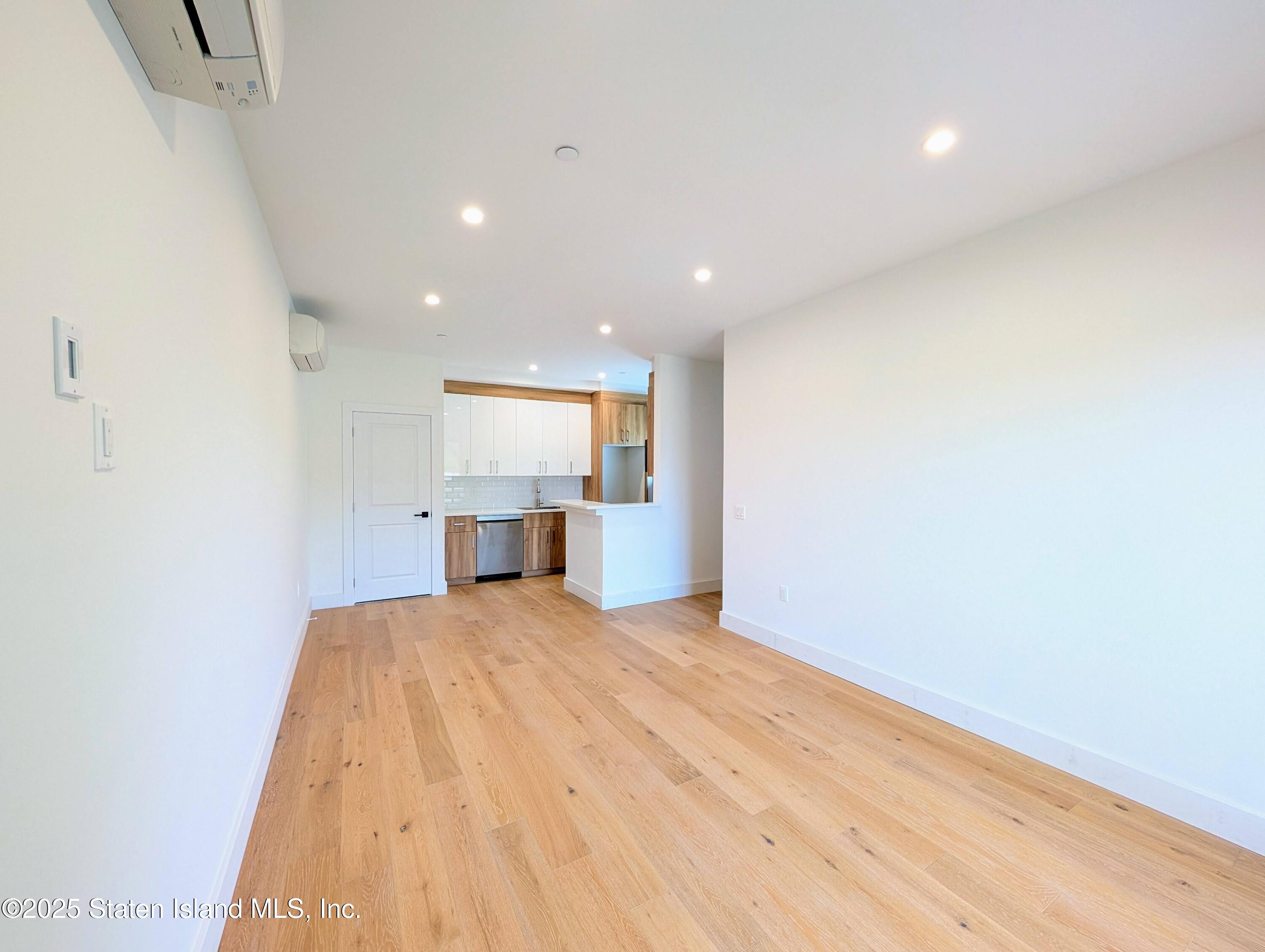 3865 Amboy Road, Unit 4D Staten Island, NY 10308 - Photo 20 of 30 a view of empty room with wooden floor and window