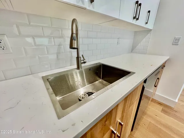 a bathroom with a sink and mirror