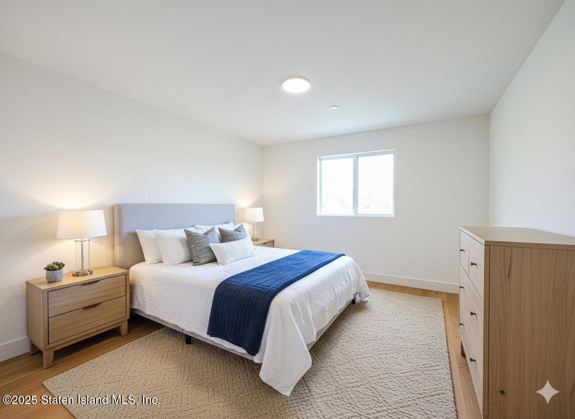 3865 Amboy Road, Unit 4D Staten Island, NY 10308 - Photo 8 of 30 a bedroom with a bed and a window