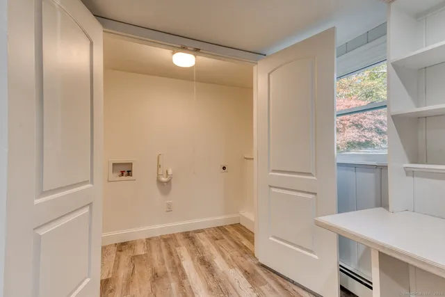 a view of kitchen and utility area