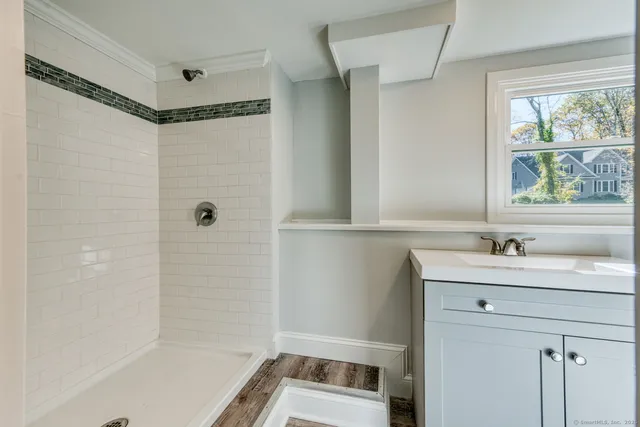 a bathroom with a sink and a shower